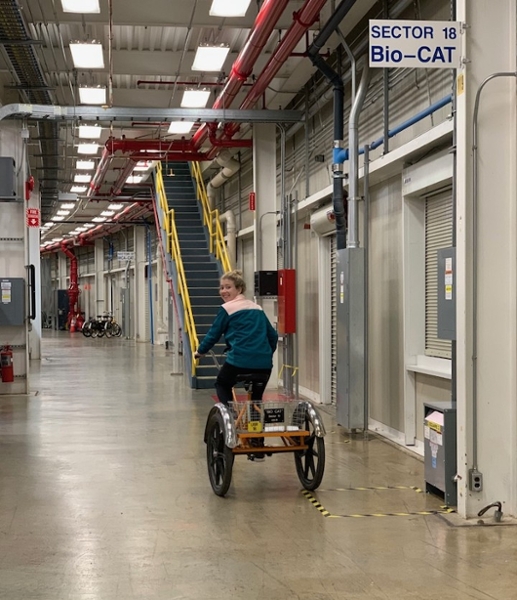 Anna rides a tricycle at Argonne
