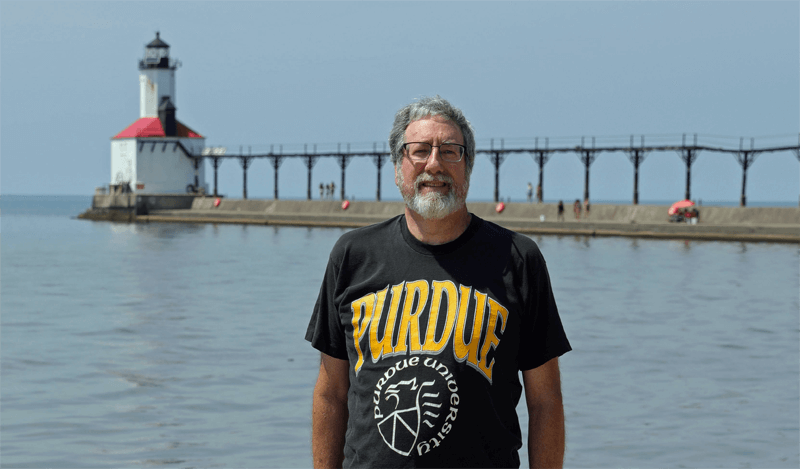 Mark Marz, retired Michigan City science teacher and Purdue Chemistry alum on Lake Michigan coastline